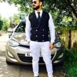 Basheer Bashi poses with his Hyundai i20 car