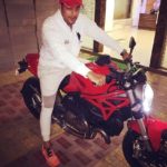 Gaurav S Bajaj poses with his Ducati Monster bike