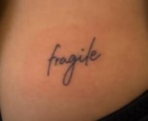 Aashna Hegde's tattoo with the word 'fragile' on her back